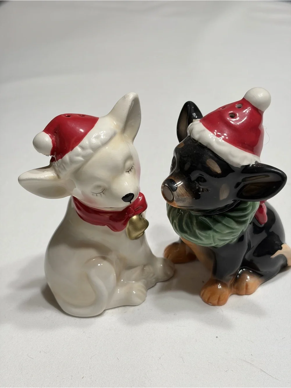 Chi Chi  Ceramic Salt and Pepper Shakers. Magnetic kissing.